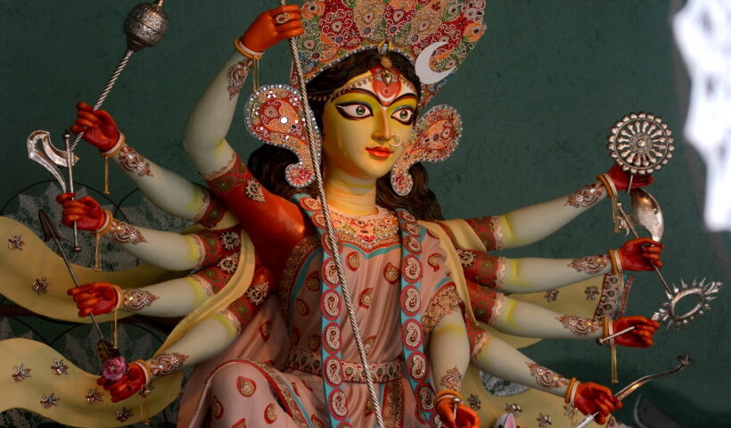 People visit the idol of Goddess Durga at a community puja pandal