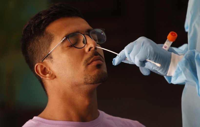 New Delhi: A health worker collects a nasal sample from a man for the RT-PCR test of Covid-19