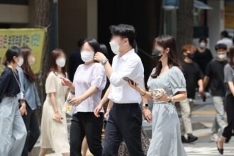 People walk along the street