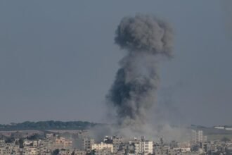 Smoke billows following an Israeli airstrike in Gaza City