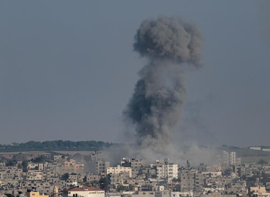 Smoke billows following an Israeli airstrike in Gaza City