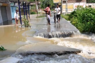 A portion of a road washed away flood affected area