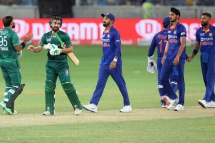 Pakistan batters Khushdil Shah,Iftikhar Ahmed, third right, are greeted by Indian players.