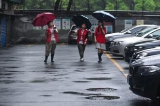 Volunteers patrol at an old residential area in Nanhu District