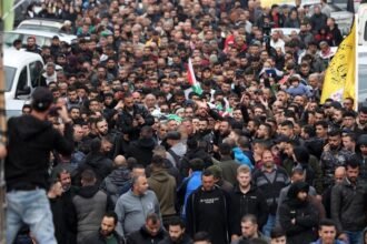 People attend a funeral of Palestinians