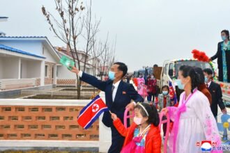 villagers looking around new dwellings