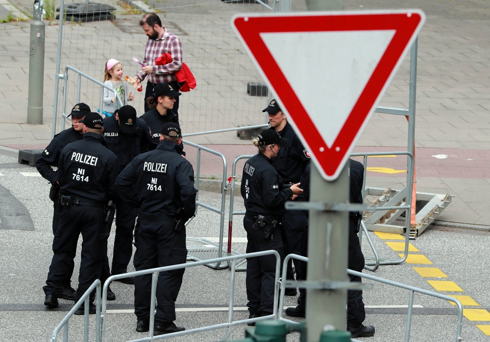 Police officers stand guard near the Hamburg Messe in Hamburg, Germany