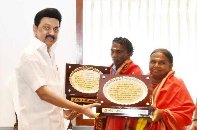 Stalin felicitates elephant whisperers Bomman and Bellie