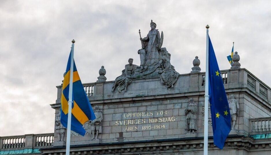 The flags of the European Union (EU) and Sweden