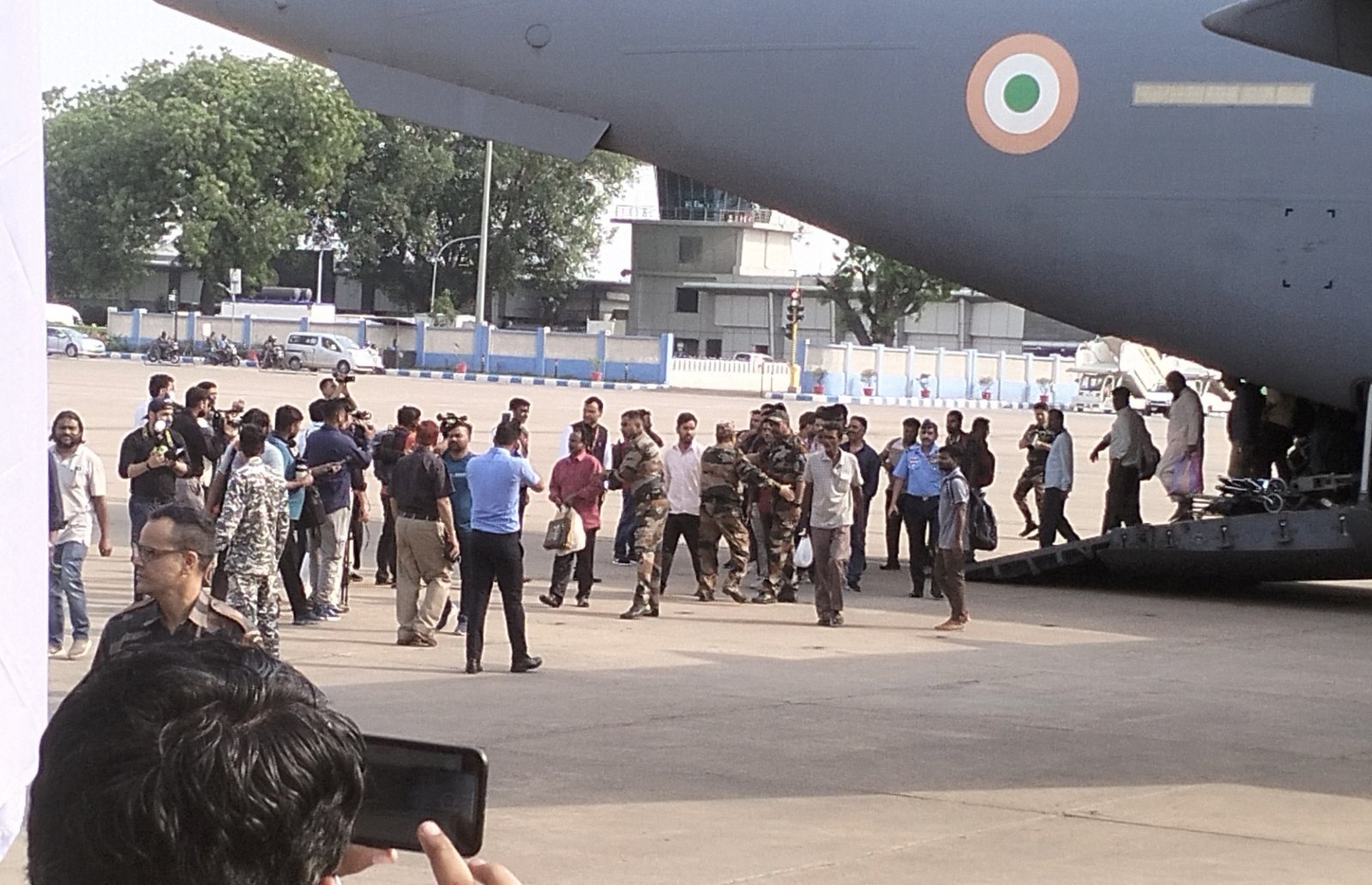 Indian Nationals coming out from an C-17 aircraft as they reach airport after being evacuated from violence-hit Sudan under 'operation kaveri',in New Delhi, on Friday, April 28, 2023