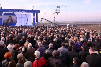 People attend the opening ceremony of a highway section in Belgrade