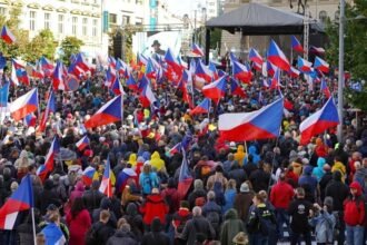 People take part in a demonstration at Wenceslas Square in Prague
