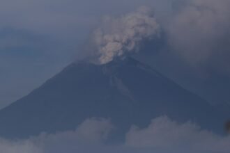 An ash column rises from the crater of the Popocatepetl volcano