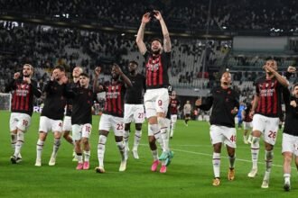 Giroud's header sends Milan past Juve and into Champions League