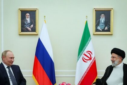 Iranian President Ebrahim Raisi (R) meets with visiting Russian President Vladimir Putin in Tehran