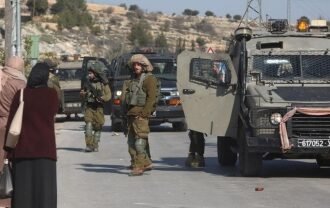 Israeli security forces gather at the site of a shooting attack