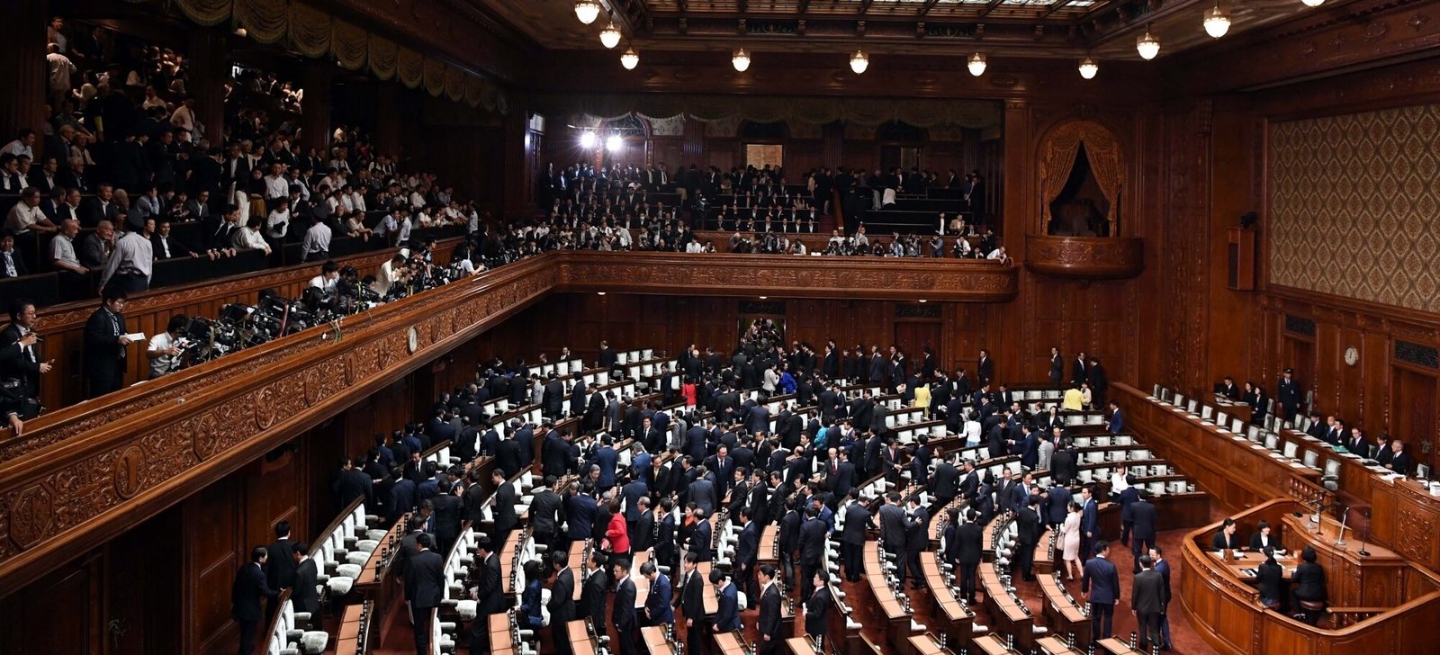 Lawmakers leave after Japanese Prime Minister Shinzo Abe dissolved the House of Representatives in Tokyo