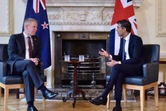 New Zealand Prime Minister Chris Hipkins and the UK's Rishi Sunak