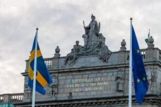 The flags of the European Union (EU) and Sweden