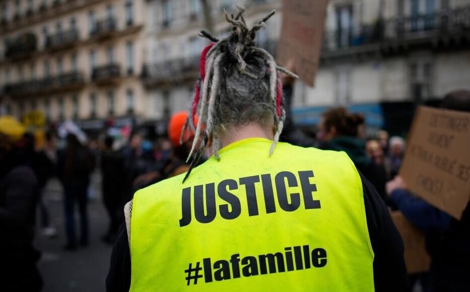 A person participates in a protest against a pension reform bill in Paris