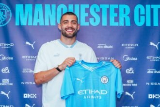 Mateo Kovacic posing with Man City jersey