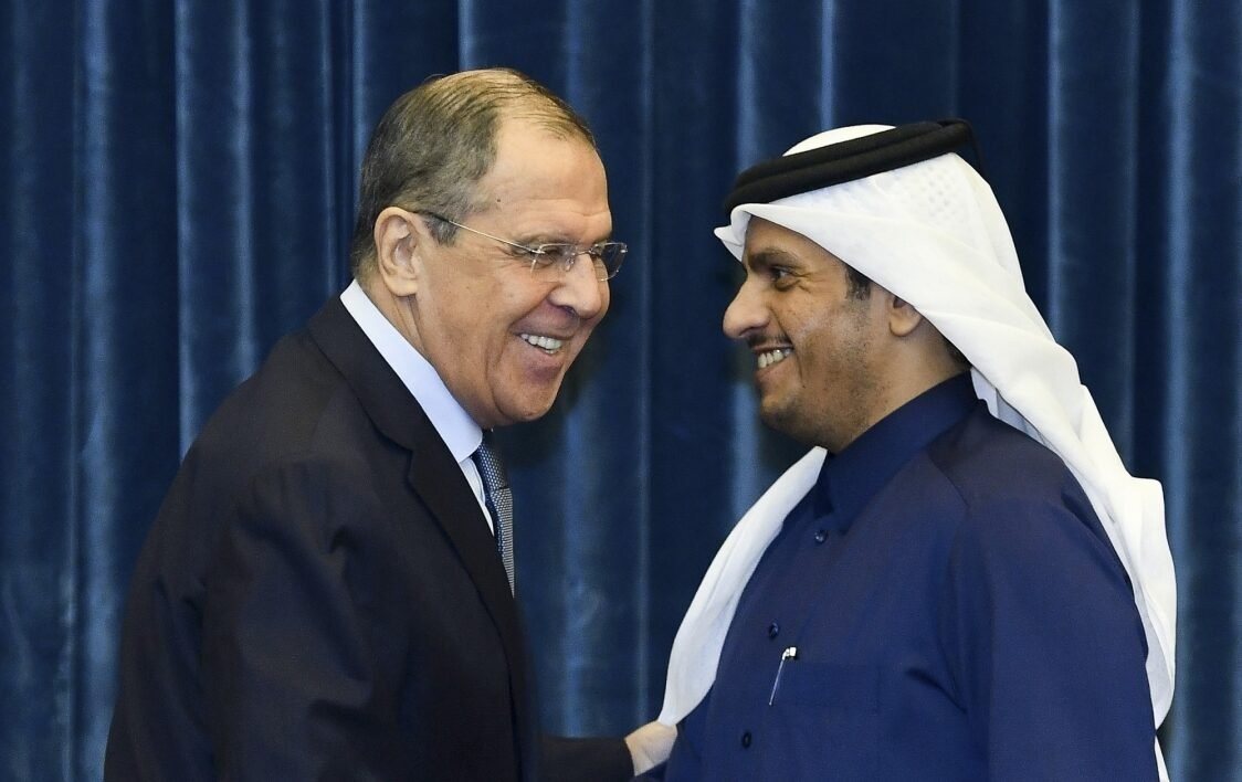 Russian Foreign Minister Sergei Lavrov (L) shakes hands with Qatari Deputy Prime Minister and Foreign Minister Sheikh Mohammed bin Abdulrahman Al-Thani